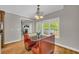 Charming dining area featuring booth seating and view of the deck through bright windows at 1213 Fairwinds Dr, Loganville, GA 30052