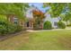 Charming home with manicured lawn, mature landscaping, and a brick-accented front entry, offering great curb appeal at 1213 Fairwinds Dr, Loganville, GA 30052