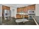 Kitchen featuring granite countertops, stainless steel appliances, and ample cabinet space at 1213 Fairwinds Dr, Loganville, GA 30052