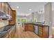Modern kitchen with granite countertops, stainless steel appliances, and hardwood floors throughout at 1213 Fairwinds Dr, Loganville, GA 30052