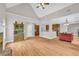 Expansive living area showcasing hardwood floors connecting to kitchen and dining spaces with a fireplace focal point at 1213 Fairwinds Dr, Loganville, GA 30052