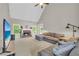 Spacious living room featuring a cozy fireplace, plush sectional sofa, and lots of natural light from large windows at 1213 Fairwinds Dr, Loganville, GA 30052