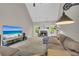 Comfortable living room showcasing a fireplace, large sectional sofa, and a vaulted ceiling, perfect for relaxation at 1213 Fairwinds Dr, Loganville, GA 30052
