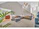 Open living room with high ceilings, staircase, and large windows bringing in natural light at 1213 Fairwinds Dr, Loganville, GA 30052