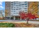 Residential high-rise building with well-maintained landscaping and a circle drive entrance at 215 Piedmont Ne Ave # 303, Atlanta, GA 30308