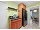 Kitchenette with a mini fridge, coffee station, and an open view to the dining area at 215 Piedmont Ne Ave # 303, Atlanta, GA 30308