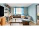 Cozy living room featuring a sofa with a desk, shelving, and lots of natural light at 215 Piedmont Ne Ave # 303, Atlanta, GA 30308