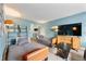 Cozy living room with convertible sofas, TV, and a decorative ladder for a warm feel at 215 Piedmont Ne Ave # 303, Atlanta, GA 30308