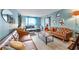 Bright living room with stylish leather sofas and a view to the entry and second bedroom at 215 Piedmont Ne Ave # 303, Atlanta, GA 30308