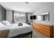 Main bedroom with comfortable bed, wood-look floors, large windows, and a spacious dresser at 215 Piedmont Ne Ave # 303, Atlanta, GA 30308