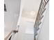 Elegant staircase with custom railings, hardwood stairs, and modern lighting at 4377 Hosch Reserve Dr, Buford, GA 30519