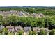Wide aerial shot of a neighborhood with mature trees, highlighting residential community and tree coverage at 580 Washington Way, Cumming, GA 30040
