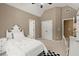 Bright bedroom shows a vaulted ceiling, a black and white rug, and closet and doorway access at 580 Washington Way, Cumming, GA 30040