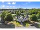 Beautiful aerial view of the clubhouse in a vibrant residential community with lush trees and well-maintained grounds at 580 Washington Way, Cumming, GA 30040