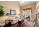 Bright living room with large windows, hardwood floors, and comfortable seating at 580 Washington Way, Cumming, GA 30040