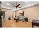 The living room features hardwood floors, neutral colors, and a ceiling fan at 580 Washington Way, Cumming, GA 30040