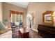 Inviting living room features large windows, vaulted ceiling, and hardwood floors at 580 Washington Way, Cumming, GA 30040