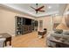 This well-lit living room features hardwood floors and a ceiling fan at 580 Washington Way, Cumming, GA 30040
