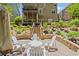 The backyard features a lovely stone patio with comfortable seating and a covered deck above, perfect for entertaining at 580 Washington Way, Cumming, GA 30040