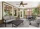 This screened-in porch offers an alternative view, showcasing the outdoor access and relaxed seating at 580 Washington Way, Cumming, GA 30040