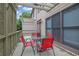 Back deck includes chairs, table, trellis, and privacy lattice at 10765 Arlington Pt, Alpharetta, GA 30022