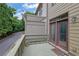 Elevated view of back deck and exterior side of the home at 10765 Arlington Pt, Alpharetta, GA 30022