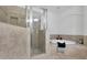 Bright bathroom featuring tiled floors, walk in shower, and separate soaking tub with decor accents at 10765 Arlington Pt, Alpharetta, GA 30022