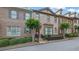 Charming brick townhome with a well-manicured front yard and inviting entrance at 10765 Arlington Pt, Alpharetta, GA 30022