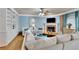 Inviting living room with fireplace, built-in shelves, and comfortable seating at 10765 Arlington Pt, Alpharetta, GA 30022