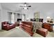 Comfortable main bedroom with a king bed, leather sofa, and side tables, complete with decor lighting at 10765 Arlington Pt, Alpharetta, GA 30022