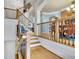 Open staircase with wood and iron railings, leading to multiple levels at 10765 Arlington Pt, Alpharetta, GA 30022