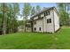Large backyard offers ample green space, ideal for relaxation and recreation at 3915 Ashley Trace Sw Ct, Lilburn, GA 30047