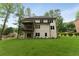 Expansive backyard featuring a covered patio/deck perfect for outdoor entertaining at 3915 Ashley Trace Sw Ct, Lilburn, GA 30047