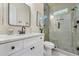 Bathroom with glass enclosed shower, black fixtures, and sleek vanity at 3915 Ashley Trace Sw Ct, Lilburn, GA 30047