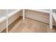 A closet with light hardwood flooring, custom white shelving, and natural light at 3915 Ashley Trace Sw Ct, Lilburn, GA 30047