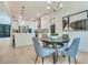 Open concept eat-in area featuring modern chandelier and lots of seating at 3915 Ashley Trace Sw Ct, Lilburn, GA 30047