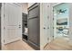 Hallway features a built-in bench and ample storage in a neutral color palette at 3915 Ashley Trace Sw Ct, Lilburn, GA 30047