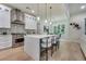 Bright, open kitchen with stainless steel appliances and a spacious island with barstool seating at 3915 Ashley Trace Sw Ct, Lilburn, GA 30047