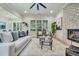 Comfortable living room with brick fireplace, large windows, and stylish furniture at 3915 Ashley Trace Sw Ct, Lilburn, GA 30047