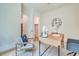 Bright office with desk, view to the yard, and comfortable chairs at 3915 Ashley Trace Sw Ct, Lilburn, GA 30047