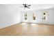 Spacious bedroom with natural light, ceiling fan and luxury hardwood floors at 415 Mayfair Ct, Alpharetta, GA 30009