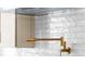 Kitchen featuring stylish bronze pot filler and white subway tile backsplash at 415 Mayfair Ct, Alpharetta, GA 30009