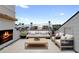 Rooftop deck with stylish outdoor fireplace and comfortable seating area, perfect for relaxation at 415 Mayfair Ct, Alpharetta, GA 30009