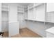Large walk-in closet featuring custom shelving and racks for optimal storage at 415 Mayfair Ct, Alpharetta, GA 30009
