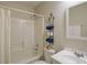 Bright bathroom features a shower and tub combination, along with decorative towel rack and vanity sink at 5742 Riverside Walk Dr, Sugar Hill, GA 30518