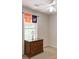 Bright bedroom with a wooden dresser and decor by the window at 5742 Riverside Walk Dr, Sugar Hill, GA 30518