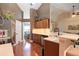 Eat-in kitchen with hardwood floors and stainless steel dishwasher, sink, and microwave at 5742 Riverside Walk Dr, Sugar Hill, GA 30518