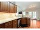 Stylish kitchen with stainless appliances and a sink overlooking the living room at 5742 Riverside Walk Dr, Sugar Hill, GA 30518