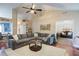Open-concept living room with vaulted ceiling and hardwood flooring throughout at 5742 Riverside Walk Dr, Sugar Hill, GA 30518