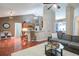 Open-concept living and dining areas with hardwood floors and natural light at 5742 Riverside Walk Dr, Sugar Hill, GA 30518
